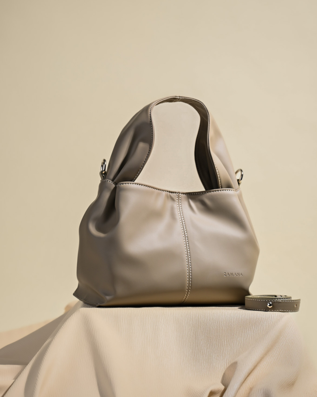 The Dumpling Beige Top Handle Bag